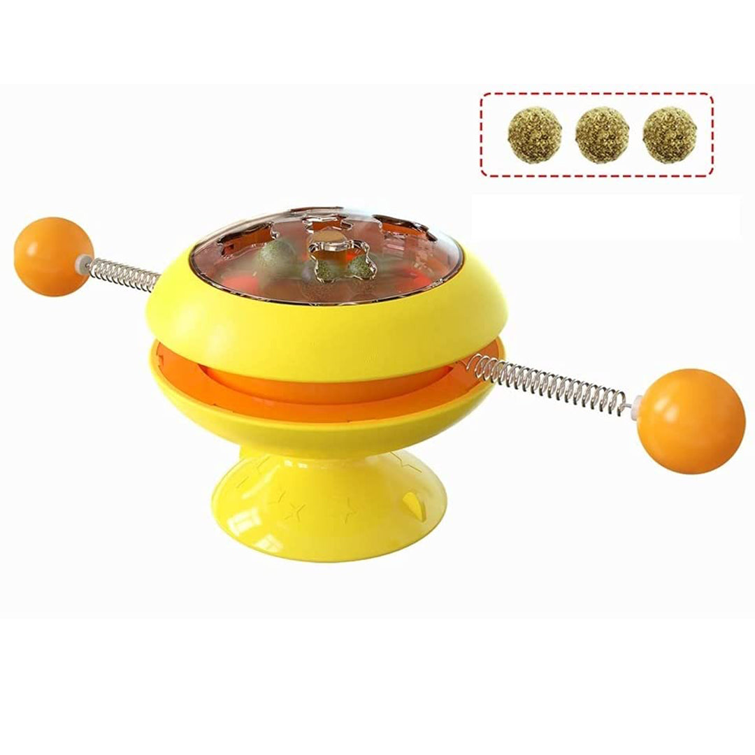 Cat playing with suction base spring toy on smooth surface