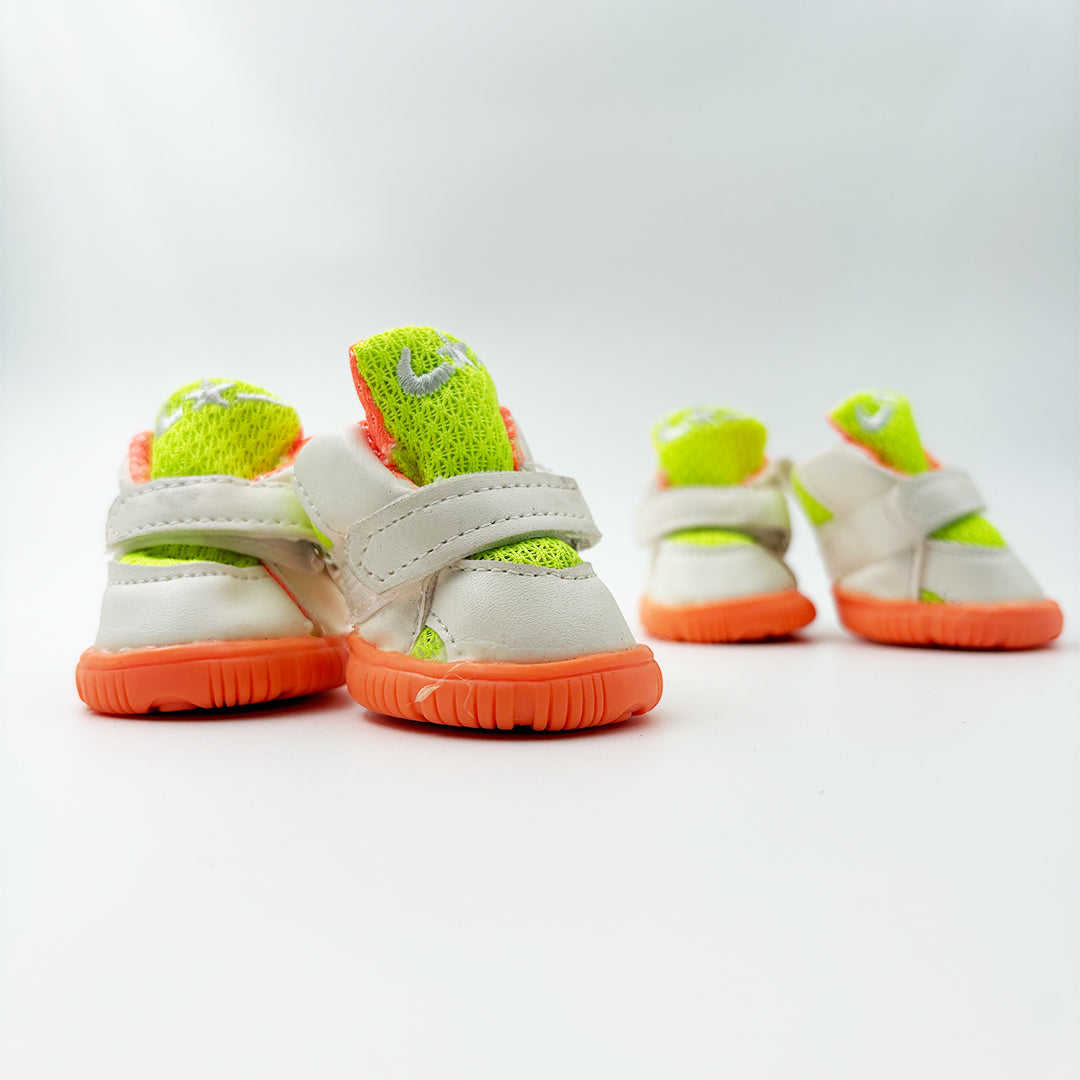 Close-up of rubber anti-slip sole on neon green dog paw shoes
