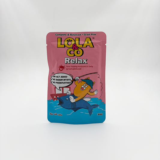 Pink packaging of LOLA & CO Relax cat treat on a white background