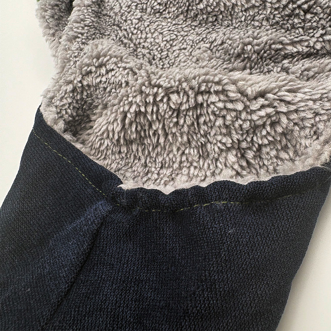 Close-up of a textured gray fabric and dark denim fabric on a white background